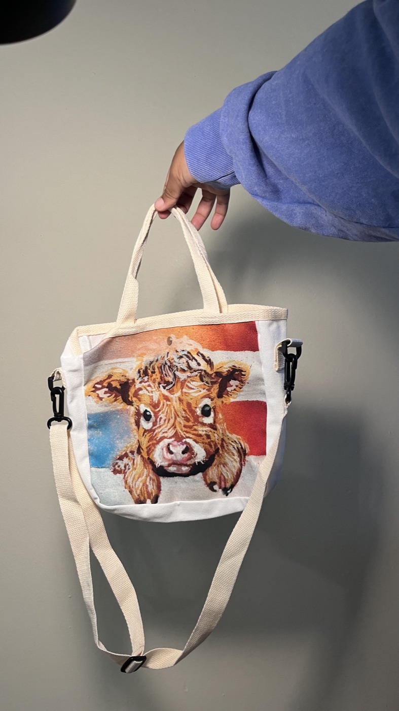 Baby Highland Cow — Handbag, photographed by the artist