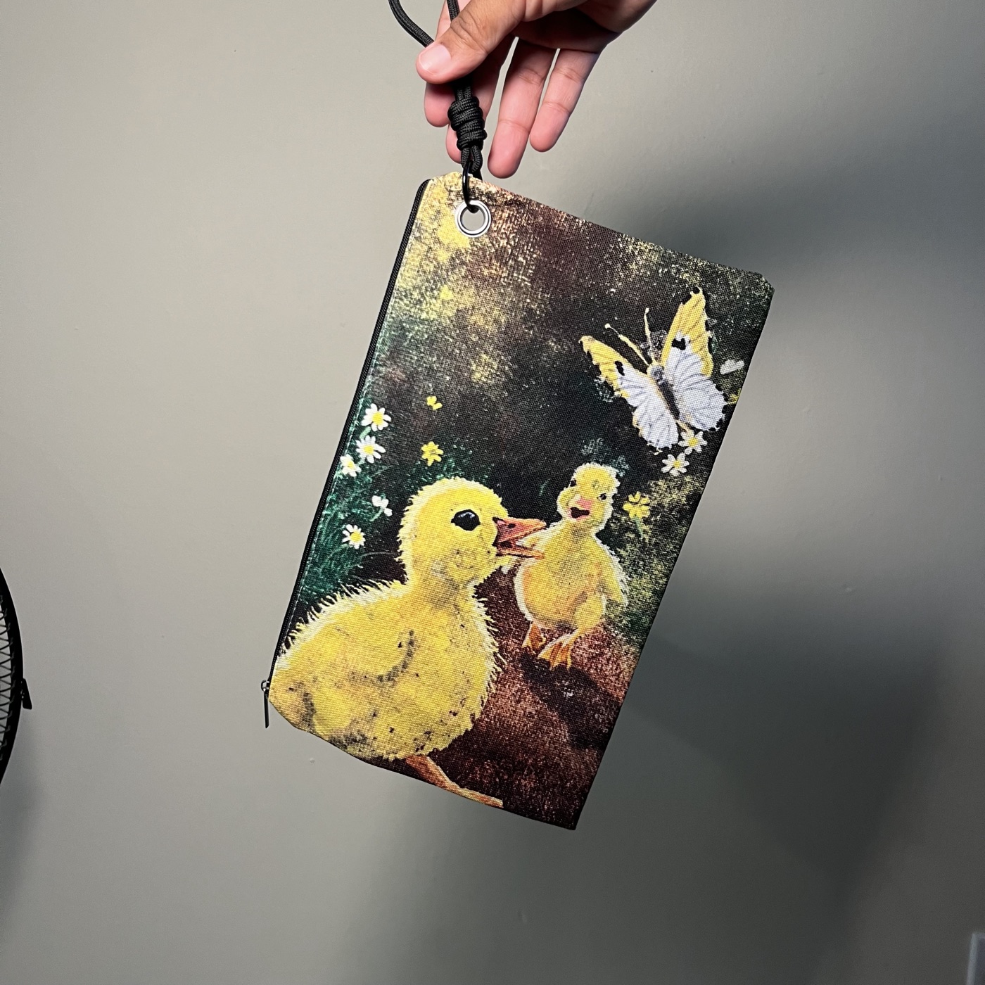Duckies Playing With Butterfly — Handbag / cosmetic bag, photographed by the artist