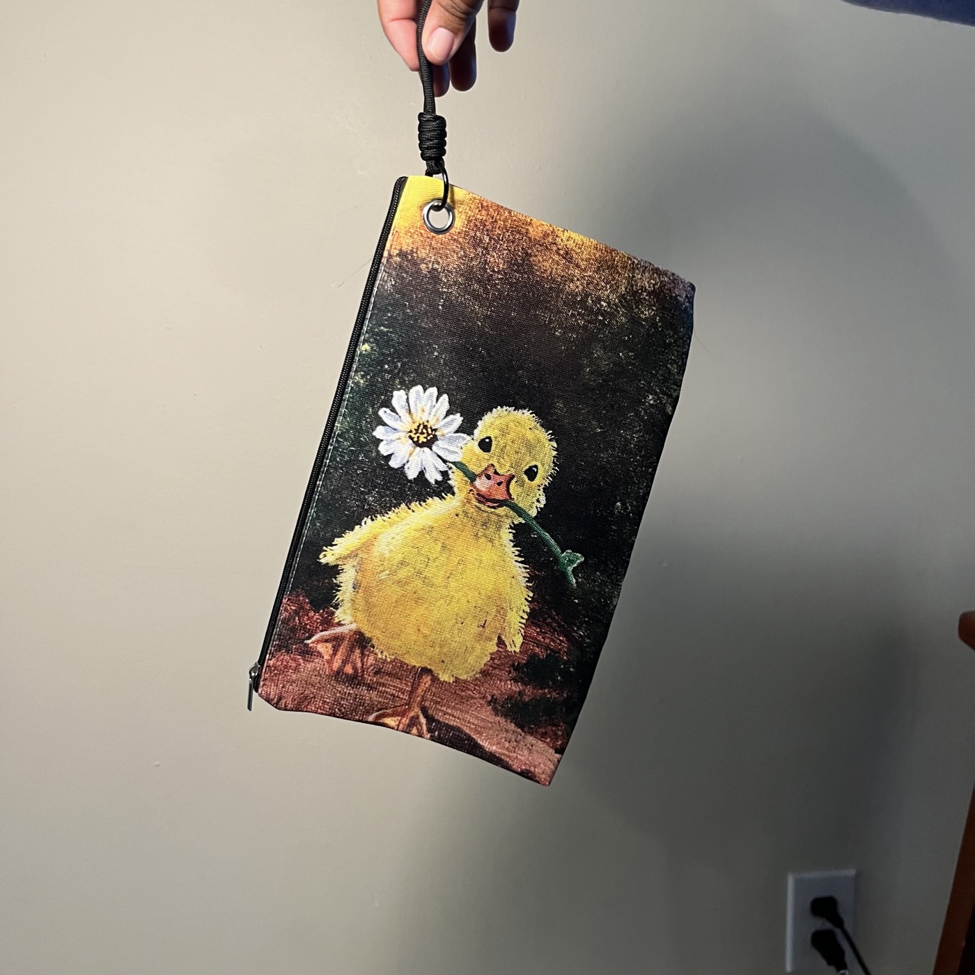 Ducky Carrying Flower — Handbag / cosmetic bag, photographed by the artist
