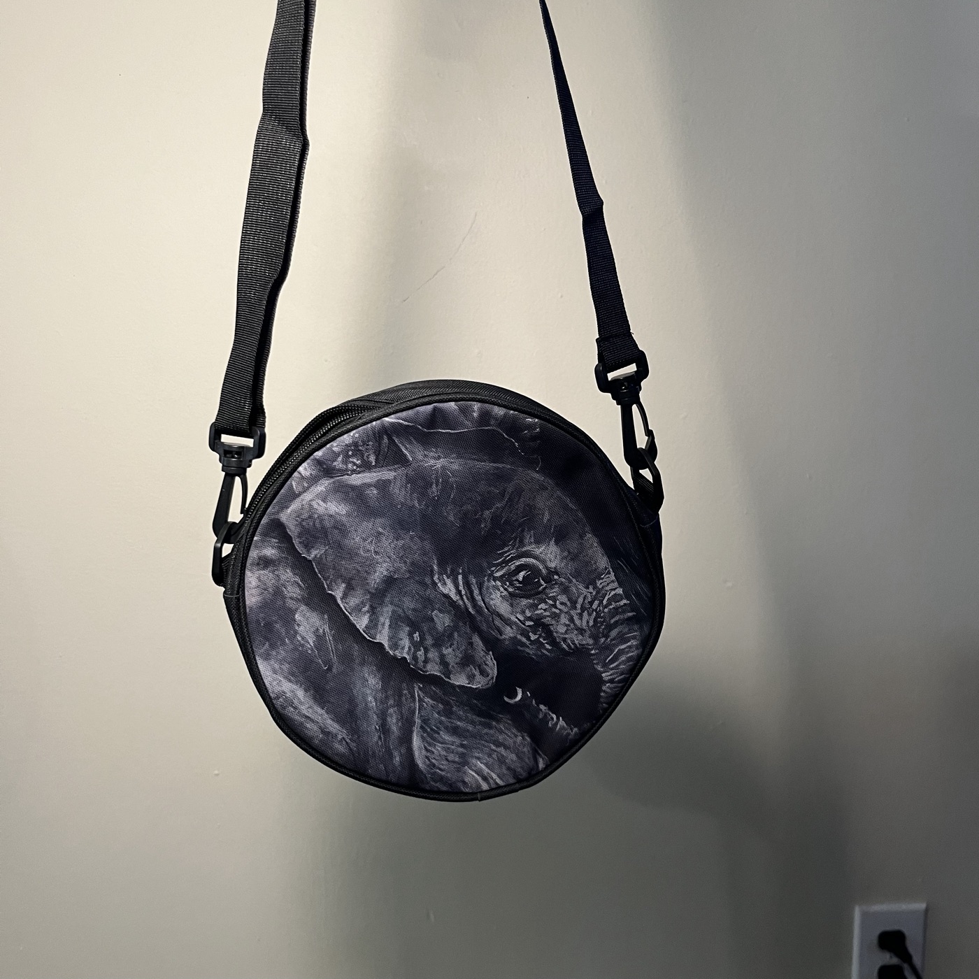 Elephants — Round crossbody bag, photographed by the artist