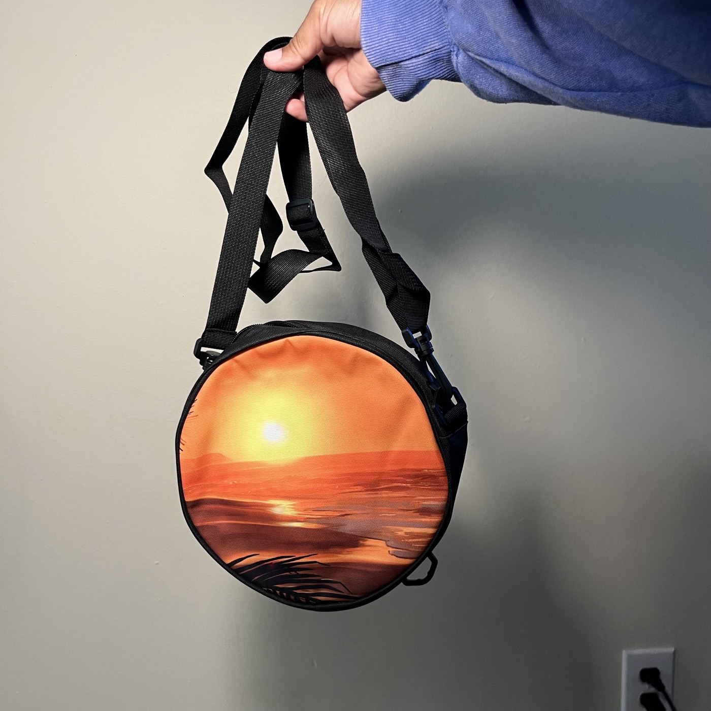 Hawaii Sunset — Round crossbody bag, photographed by the artist