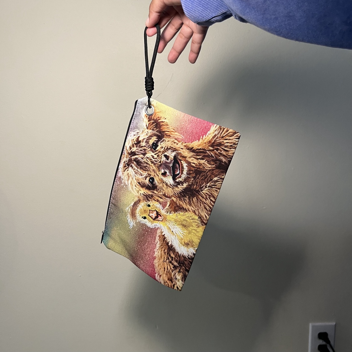Highland Cow and Ducky — Handbag / cosmetic bag, photographed by the artist