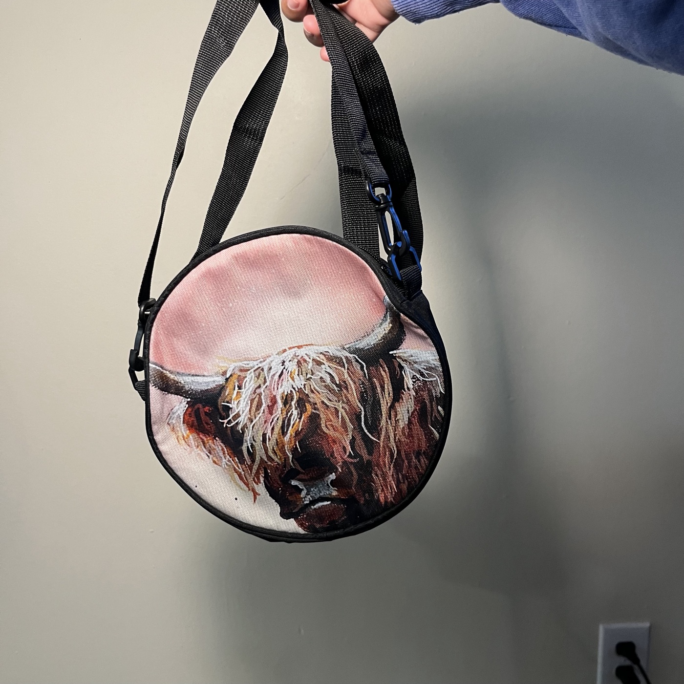 Highland Cow Stare — Round crossbody bag, photographed by the artist