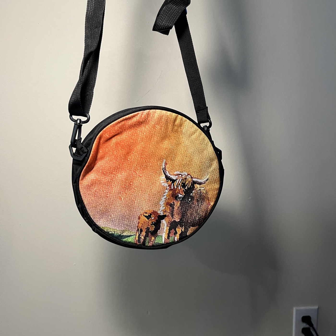 Highland Cows In The Pastures — Round crossbody bag, photographed by the artist