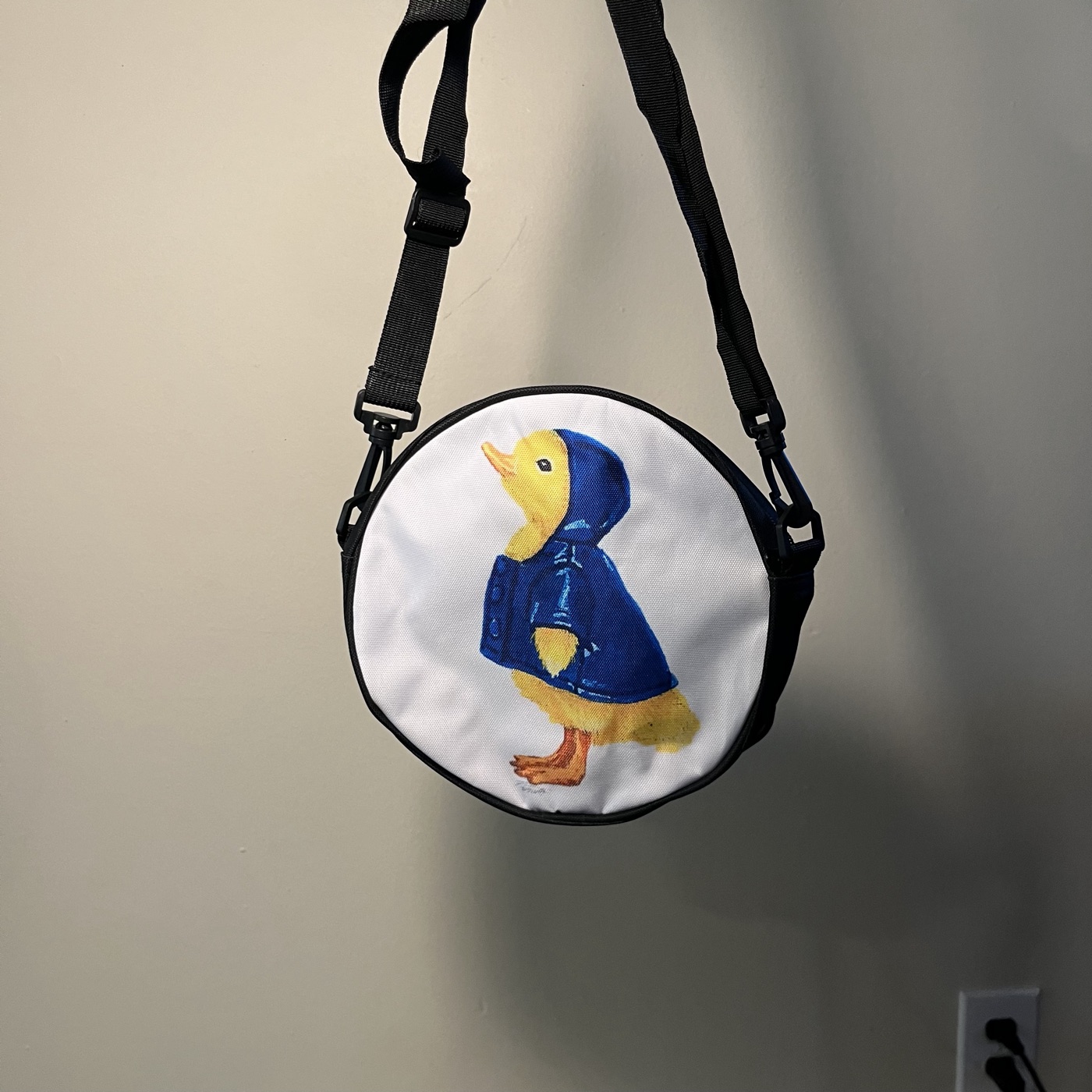 Mr. Ducky — Round crossbody bag, photographed by the artist